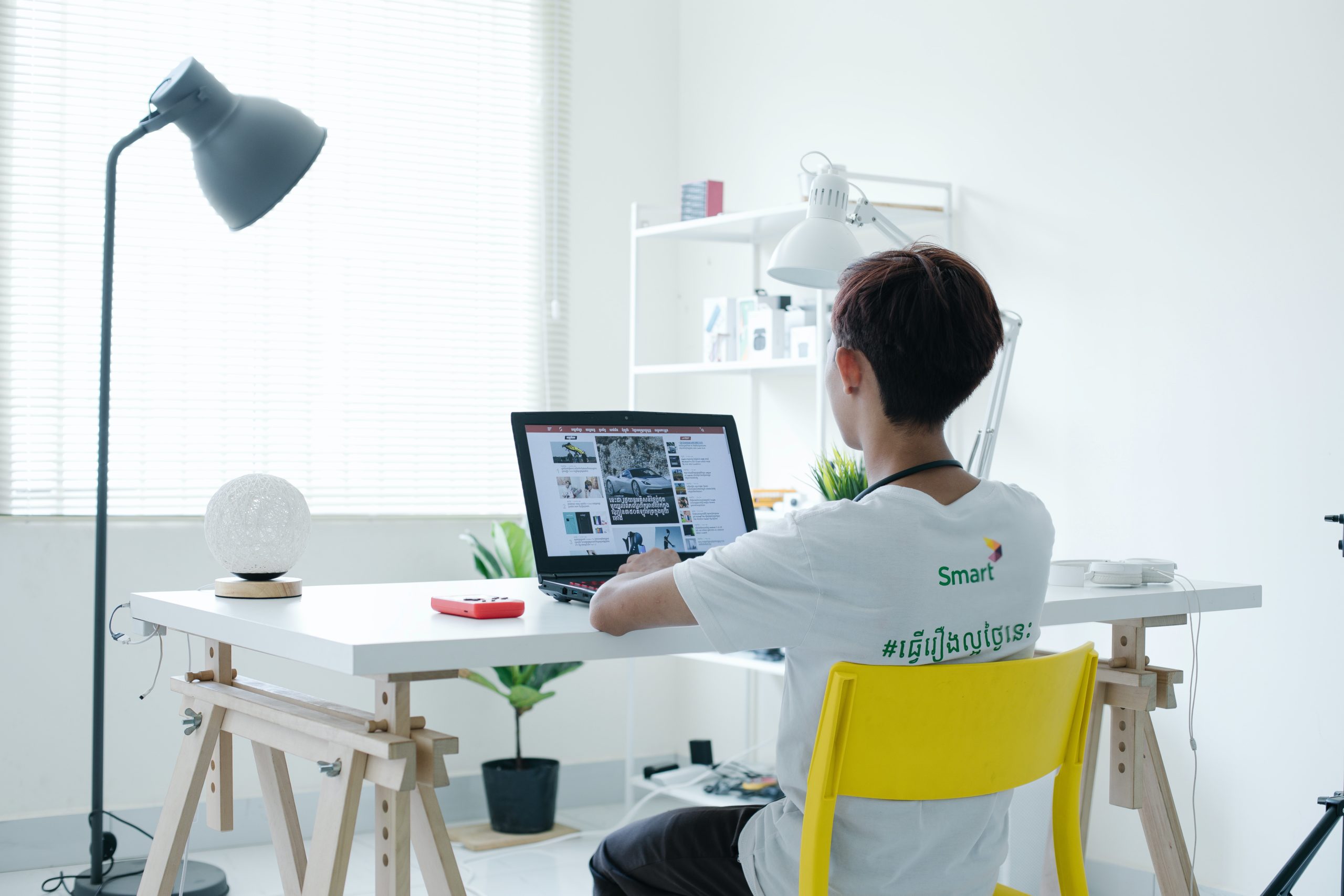 person sitting at a desk with a laptop